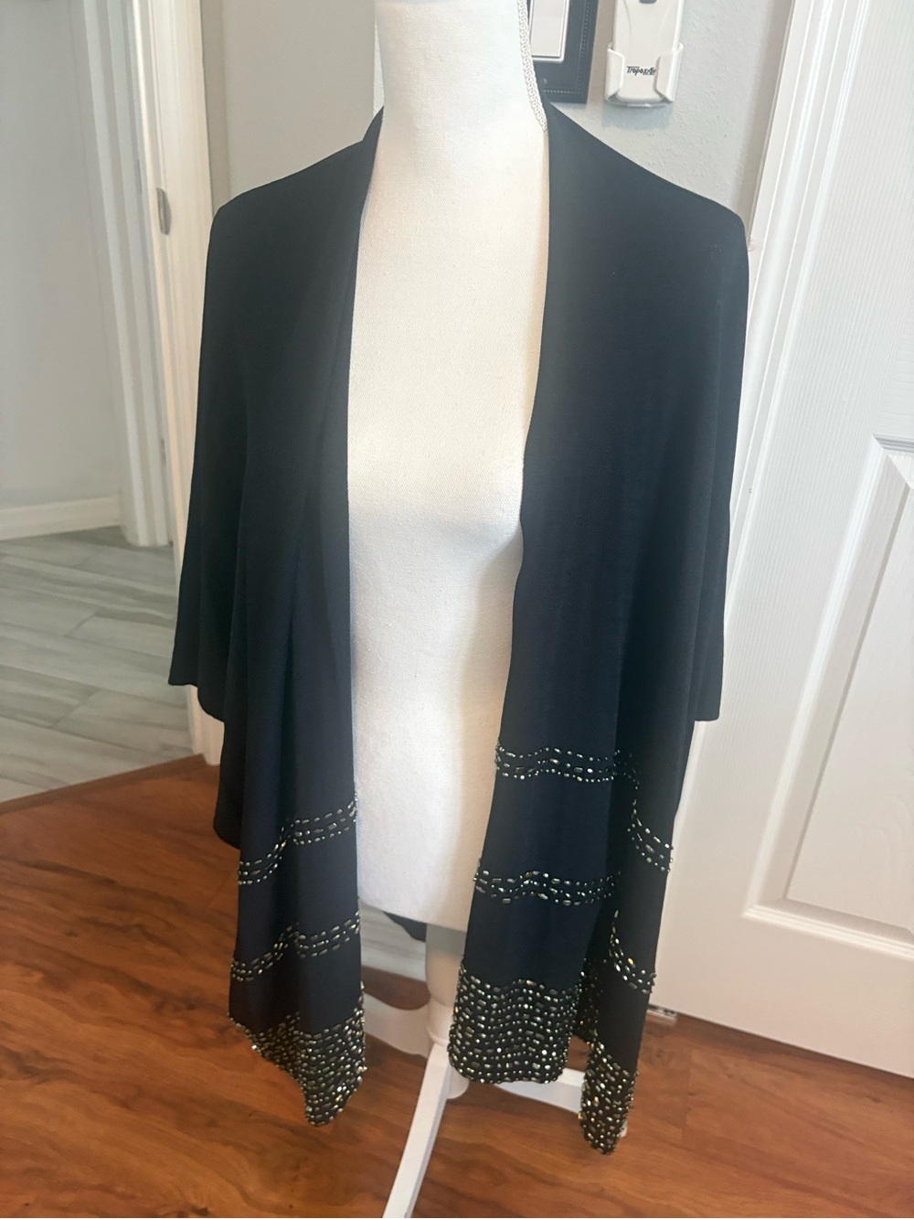Chico’s black knit ruana with sequenced deco